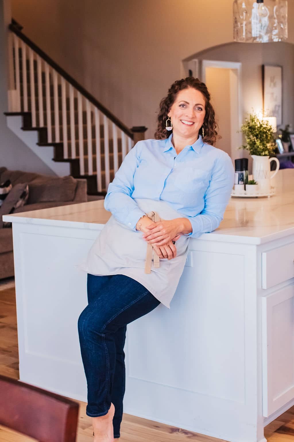 Susie leaning on the kitchen counter