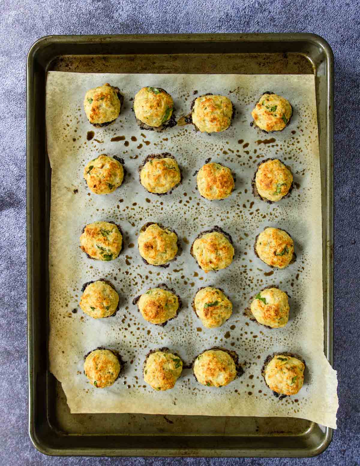 a baking pan full of baked chicken meatballs
