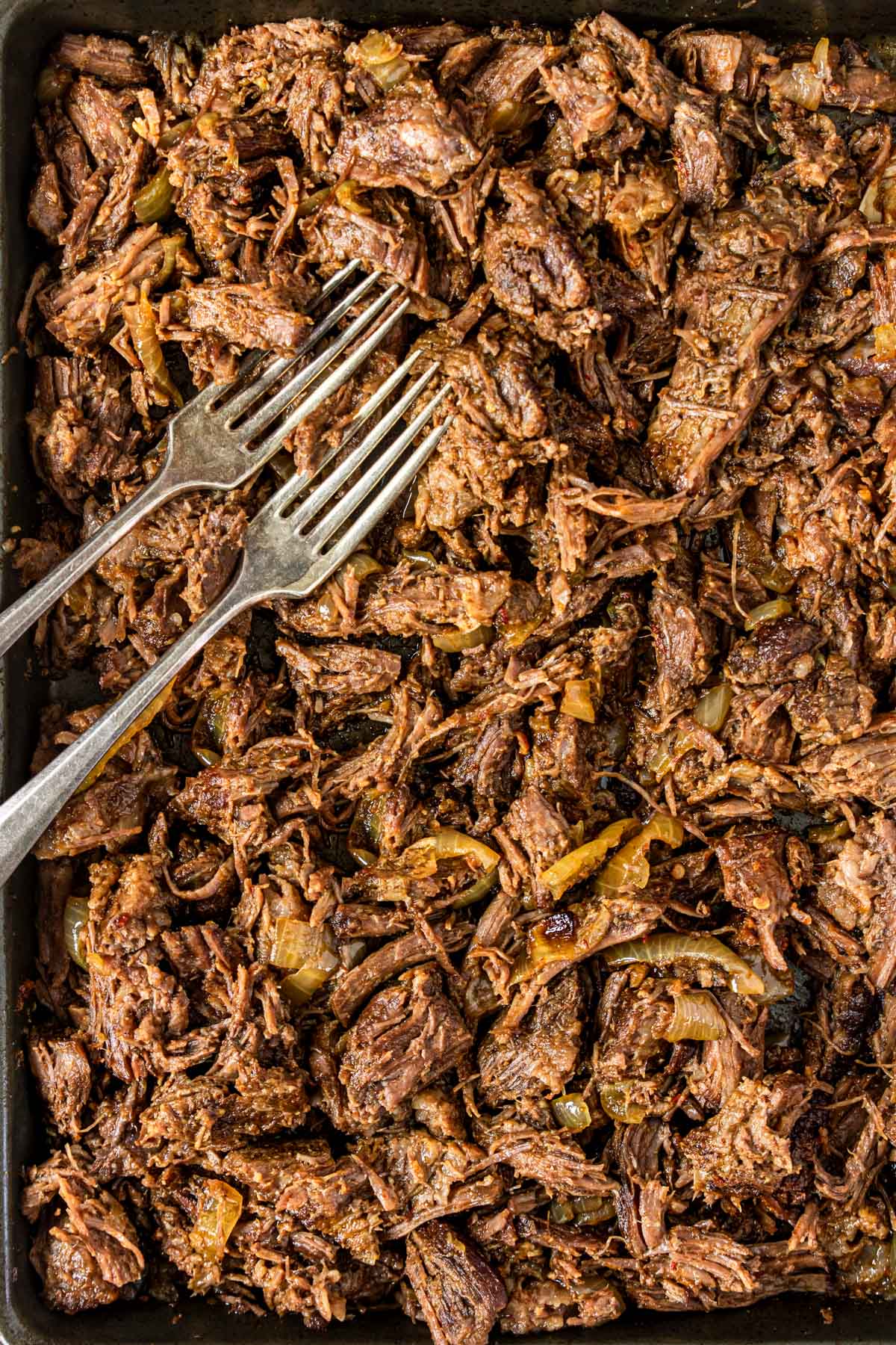 a baking sheet filled with shredded Mexican beef