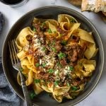 beef Ragu served over pappardelle pasta topped with parmesan cheese