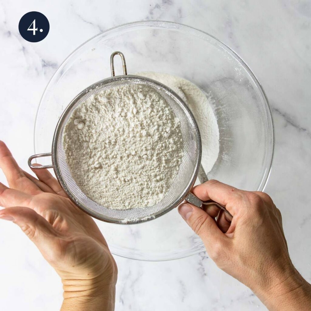 sifting flour into a bowl