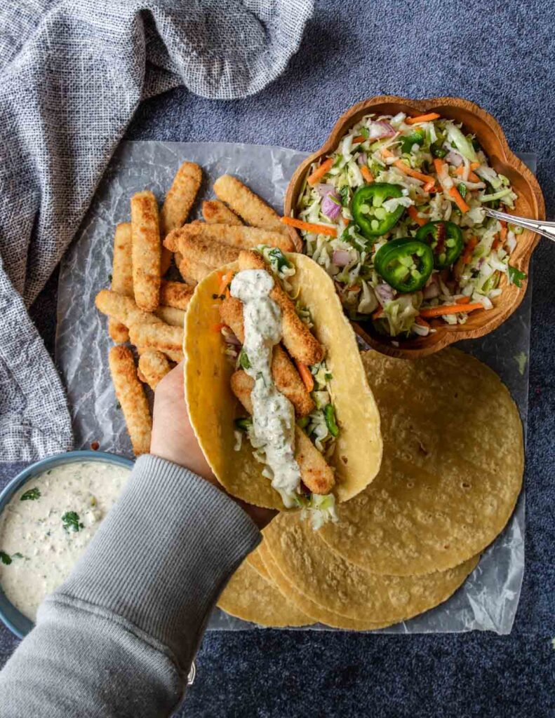 fish stick taco in a hand