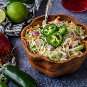 a wooden bowl of cilantro lime slaw