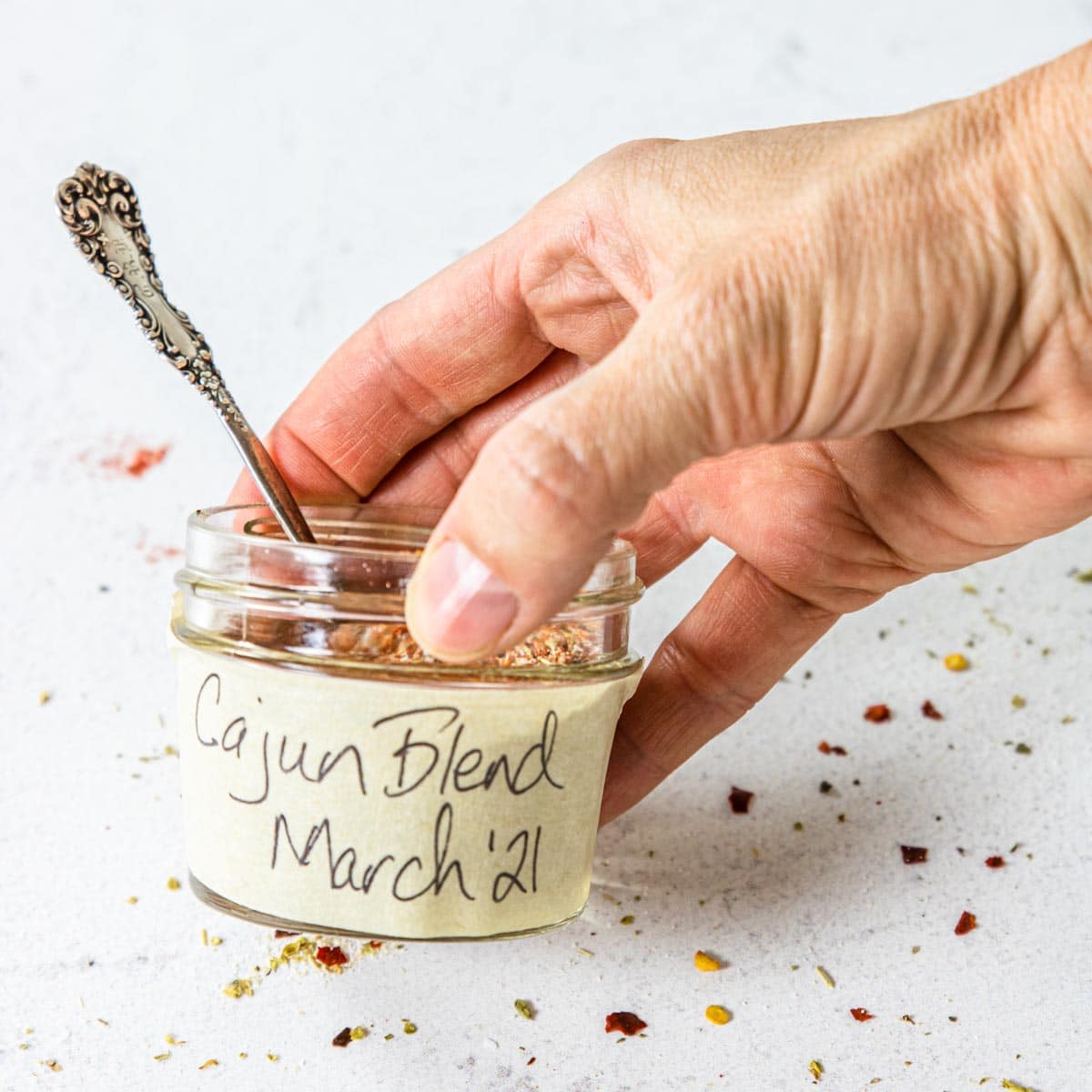 a mason jar with a label on the side that says Cajun Blend March 2021