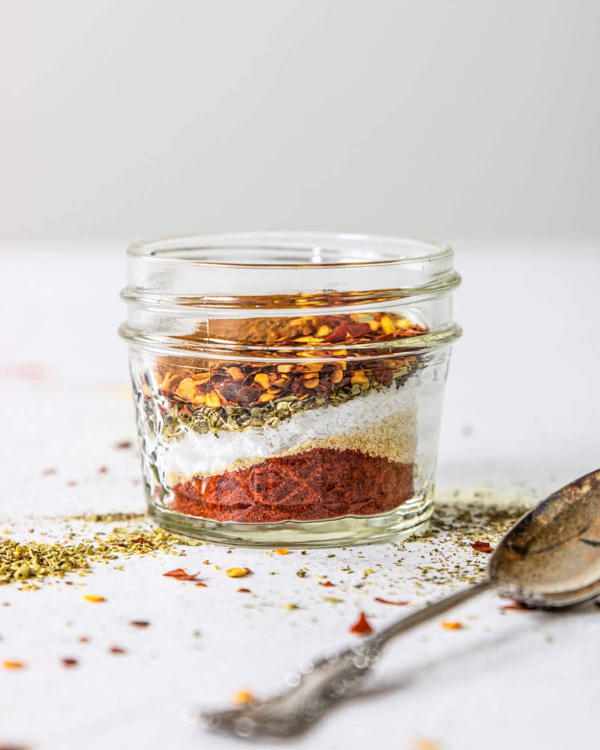 a jar that has defined layers of spices and seasonings