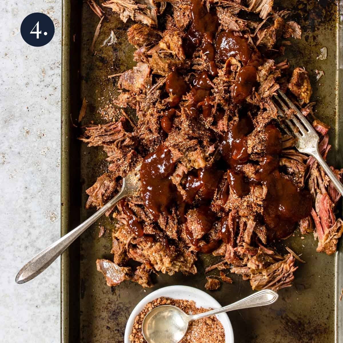BBQ sauce poured over shredded beef