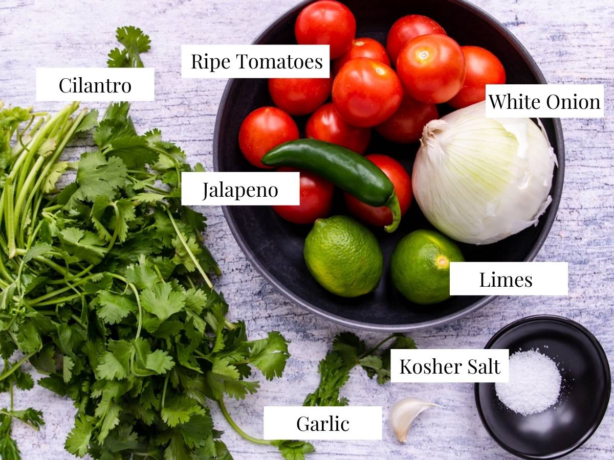 ingredients for pico de gallo on a table with text labels