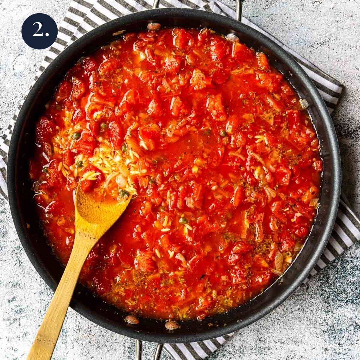 tomatoes and orzo in a pan