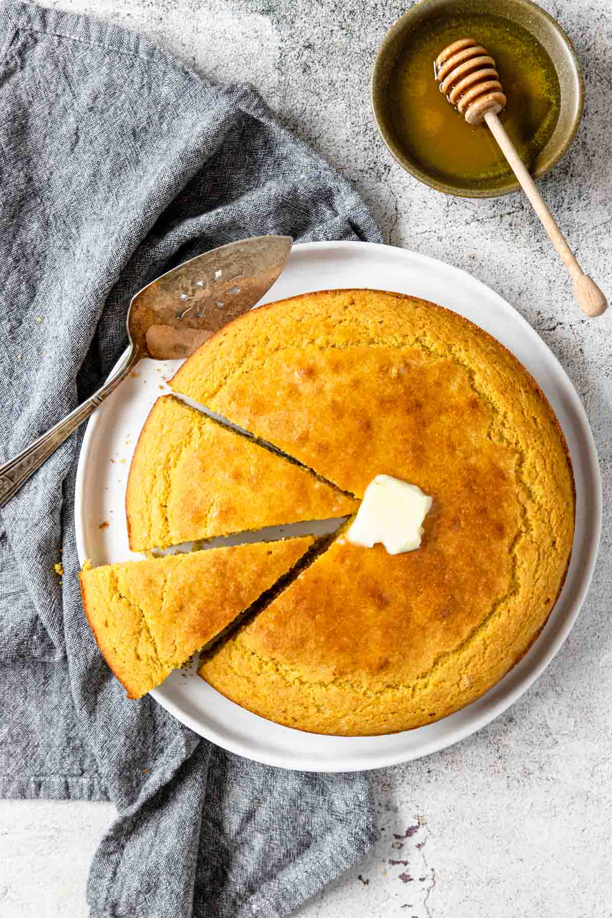 a round of cornbread with two slices pulled out