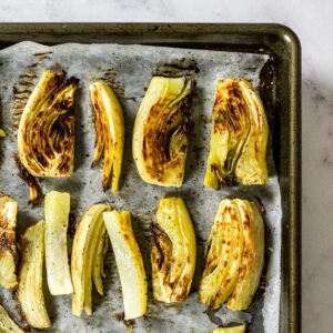 fennel that has been roasted on a baking sheet