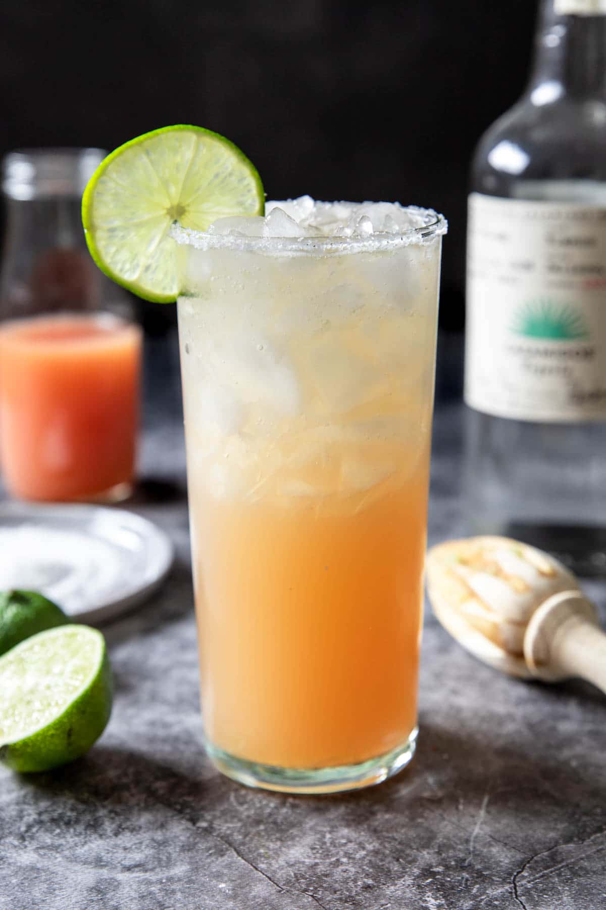 Paloma in a tall glass with a lime on the side