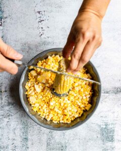 Using a bundt pan to remove corn from the cob