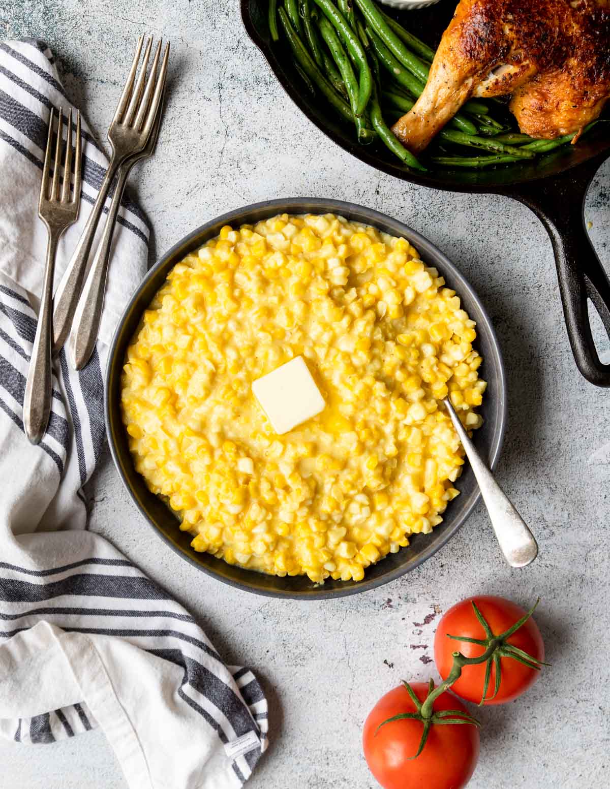 homemade creamed corn in a bowl with butter on top