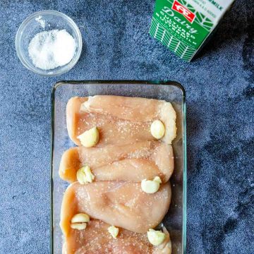 crushed garlic over raw chicken