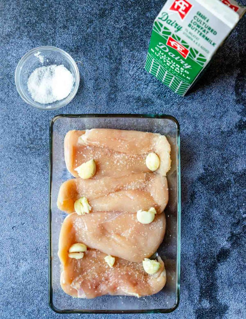 crushed garlic over raw chicken