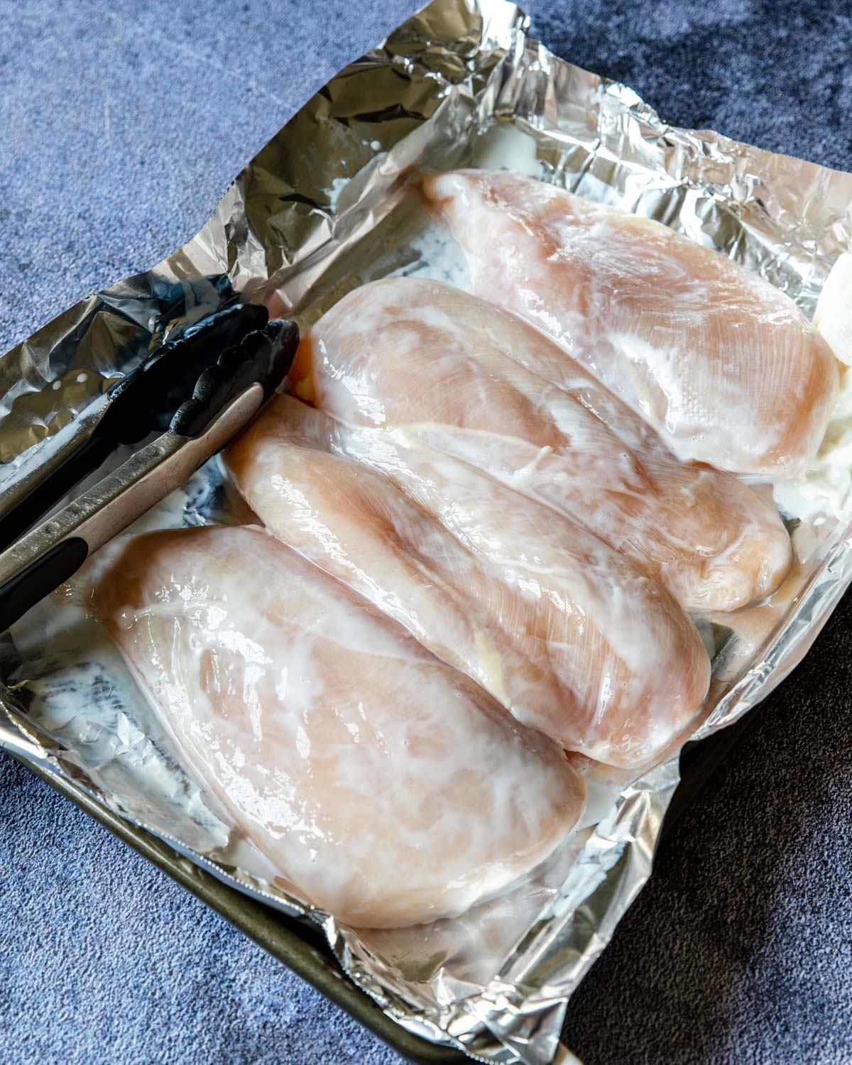 showing how to prep buttermilk marinated chicken for the grill