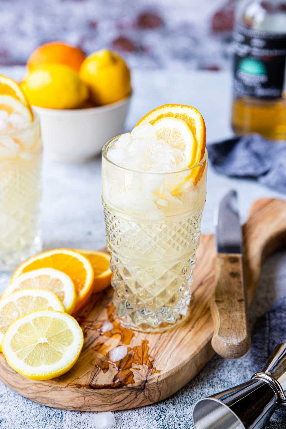 tequila cobbler in a glass garnished with lemon and orange wheel