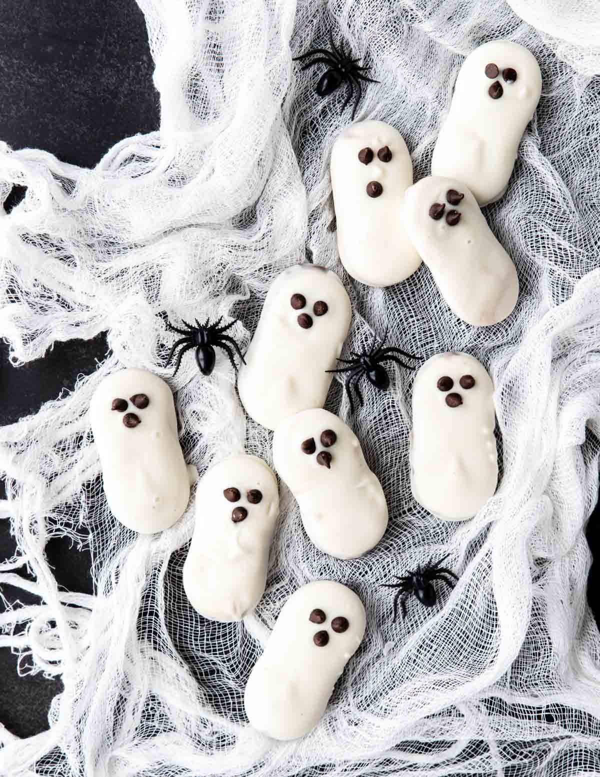 White Chocolate Ghost Cookies with mini chocolate chip eyes and mouth