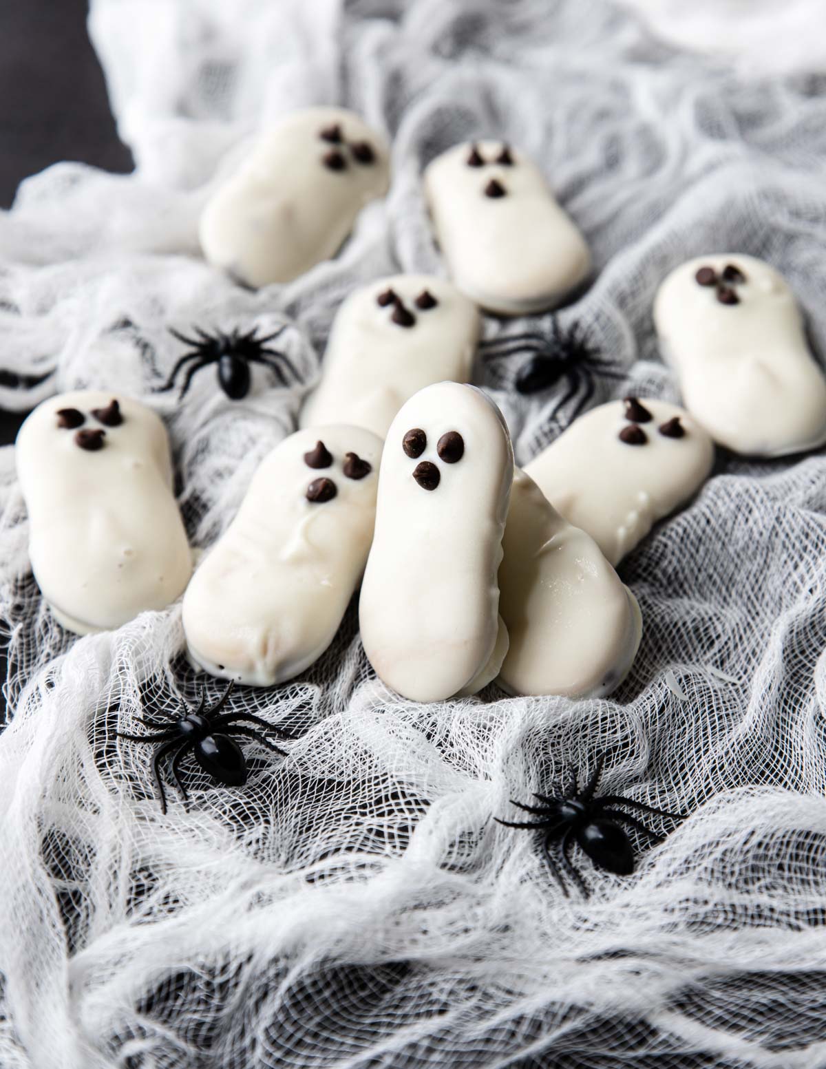 Ghost Cookies on gauze with plastic spiders