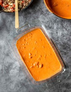 a 9x13 pan with tomato cream sauce