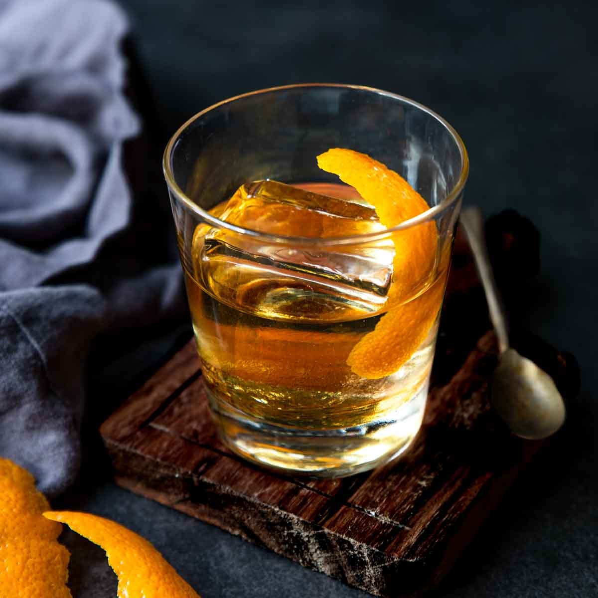 anejo old fashioned in a glass with clear ice