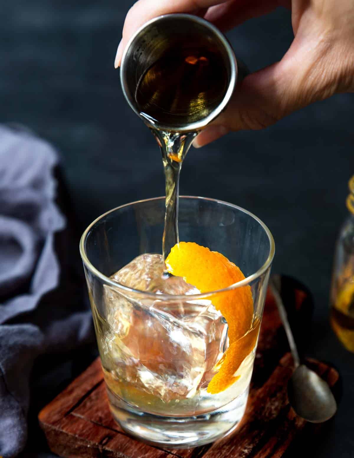 pouring Añejo over ice