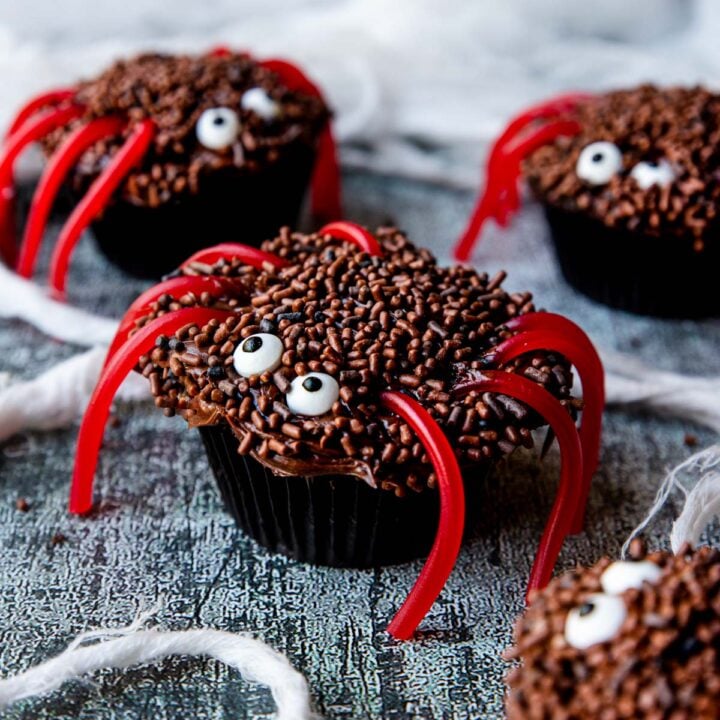 Spider cupcakes with candy eyes and licorice legs