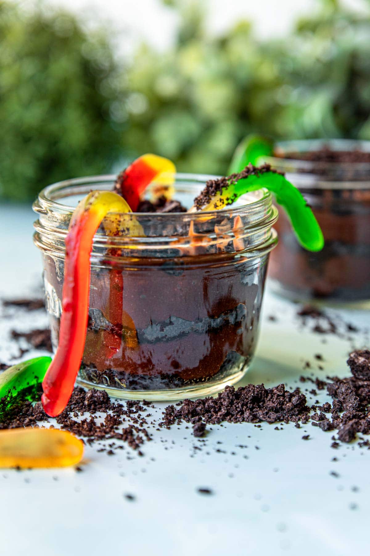 dirt and worms dessert in a small mason jar