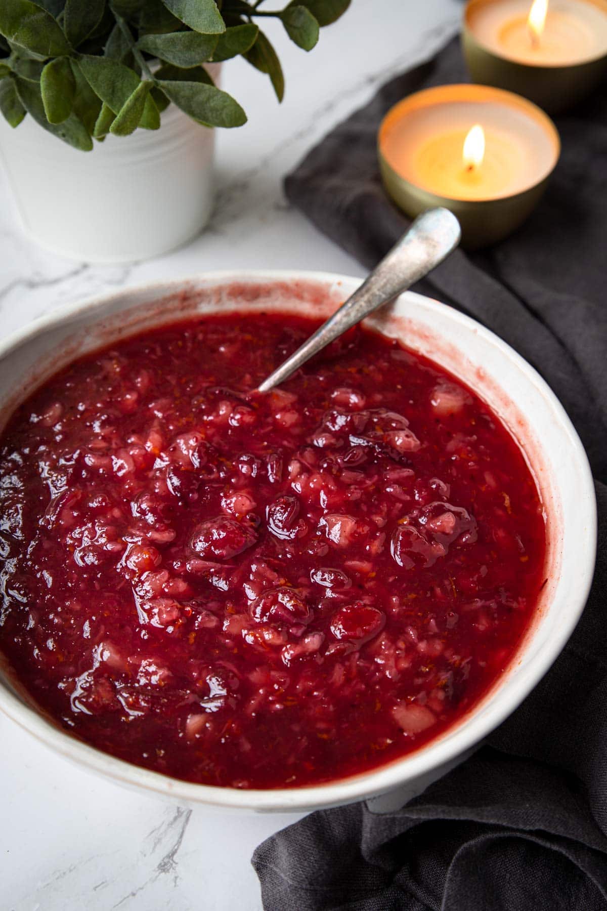 a large white bowl of cranberry sauce