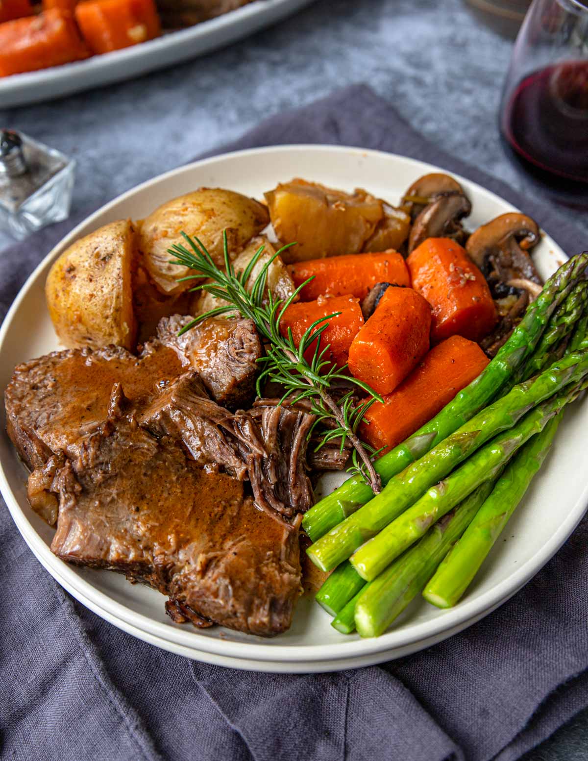 Instant Pot Pot Roast on a plate with potatoes and carrots