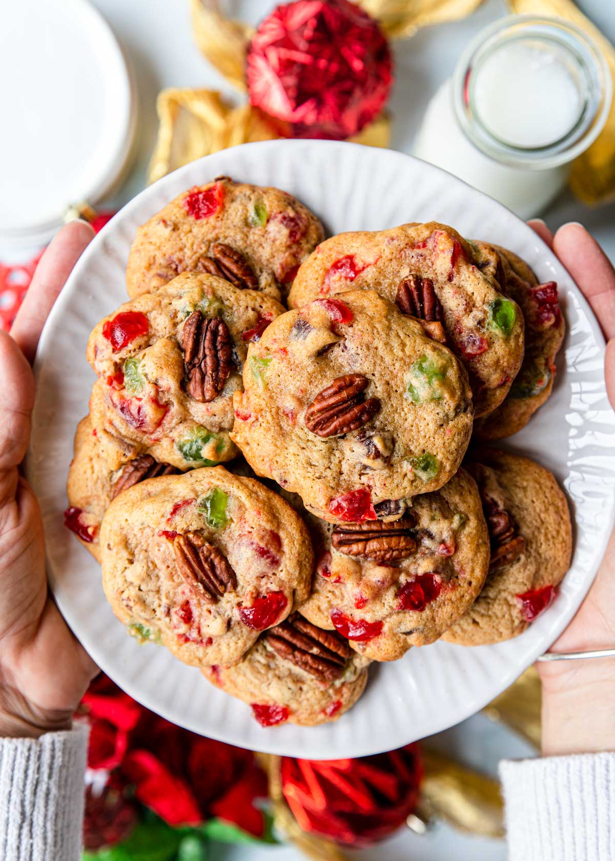 Fruitcake Drop Cookies on a plate being held for guests