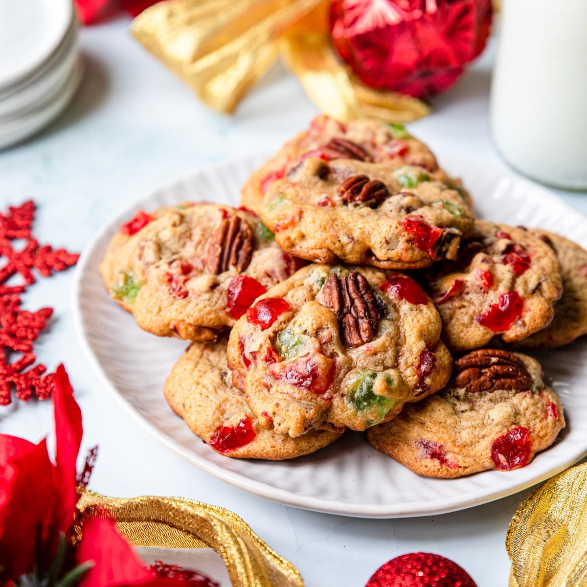 a holiday table with fruitcake cookies on a plate