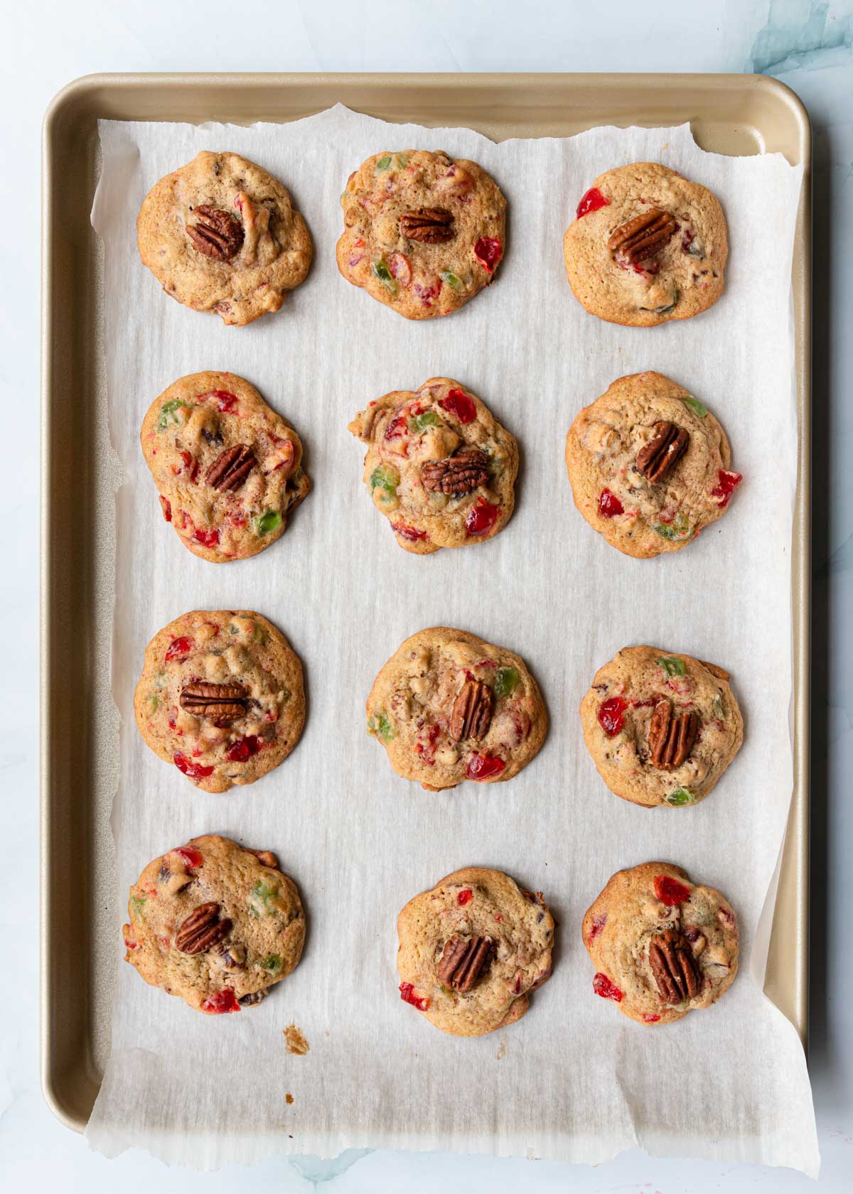 baked fruitcake drop cookies on a baking sheet