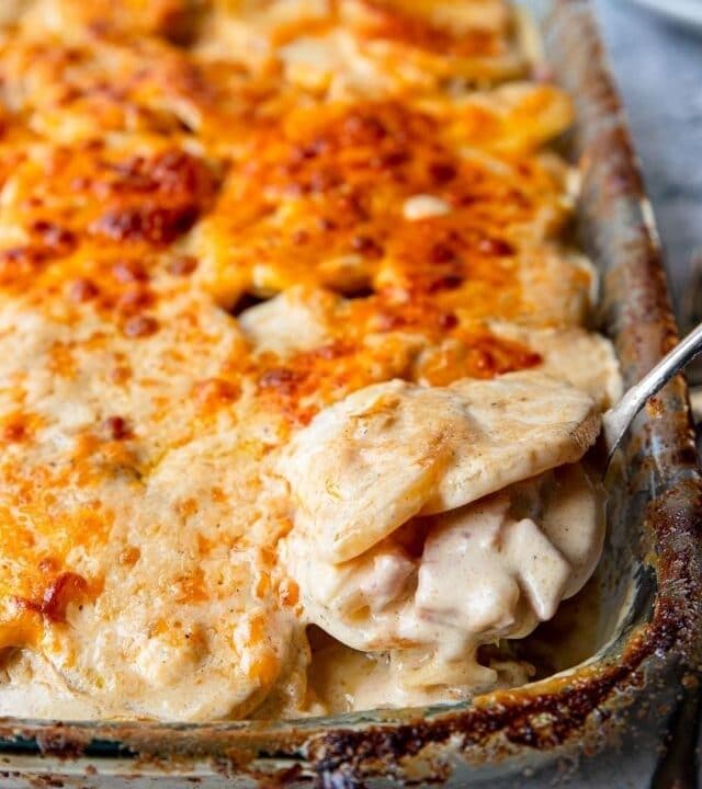 scalloped potatoes and ham in a casserole dish