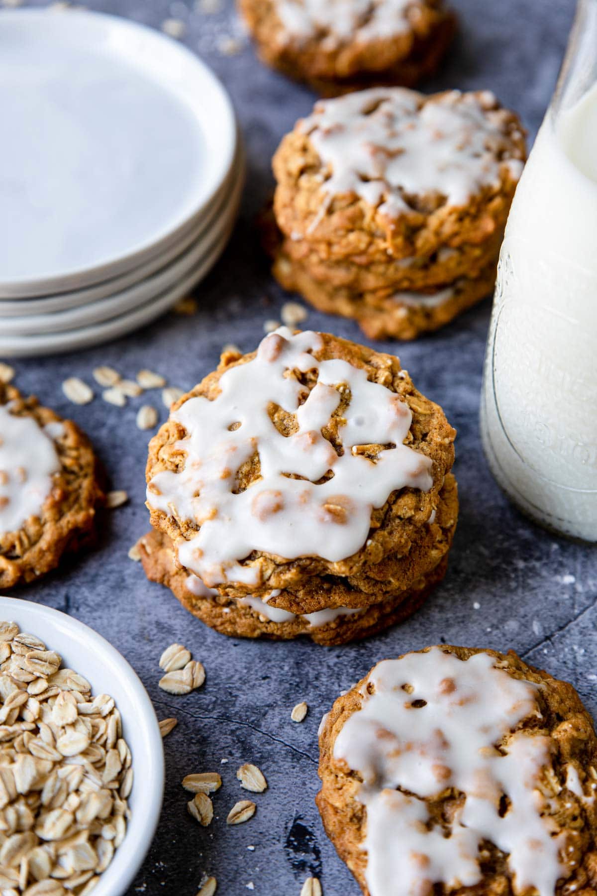 a couple iced oatmeal cookies in piles