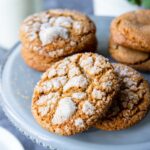 a plate with a lot of molasses cookies