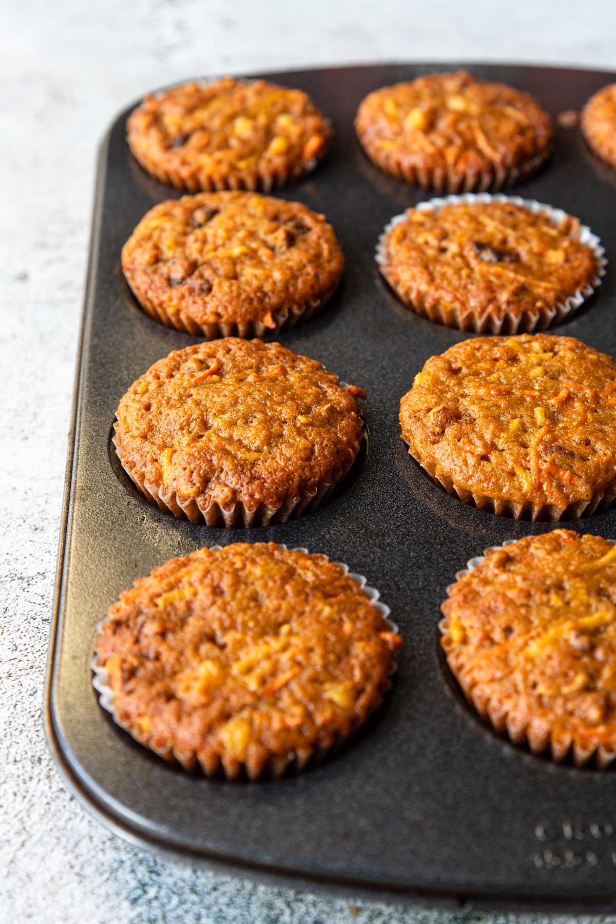 morning glory muffins baked in a muffin tin