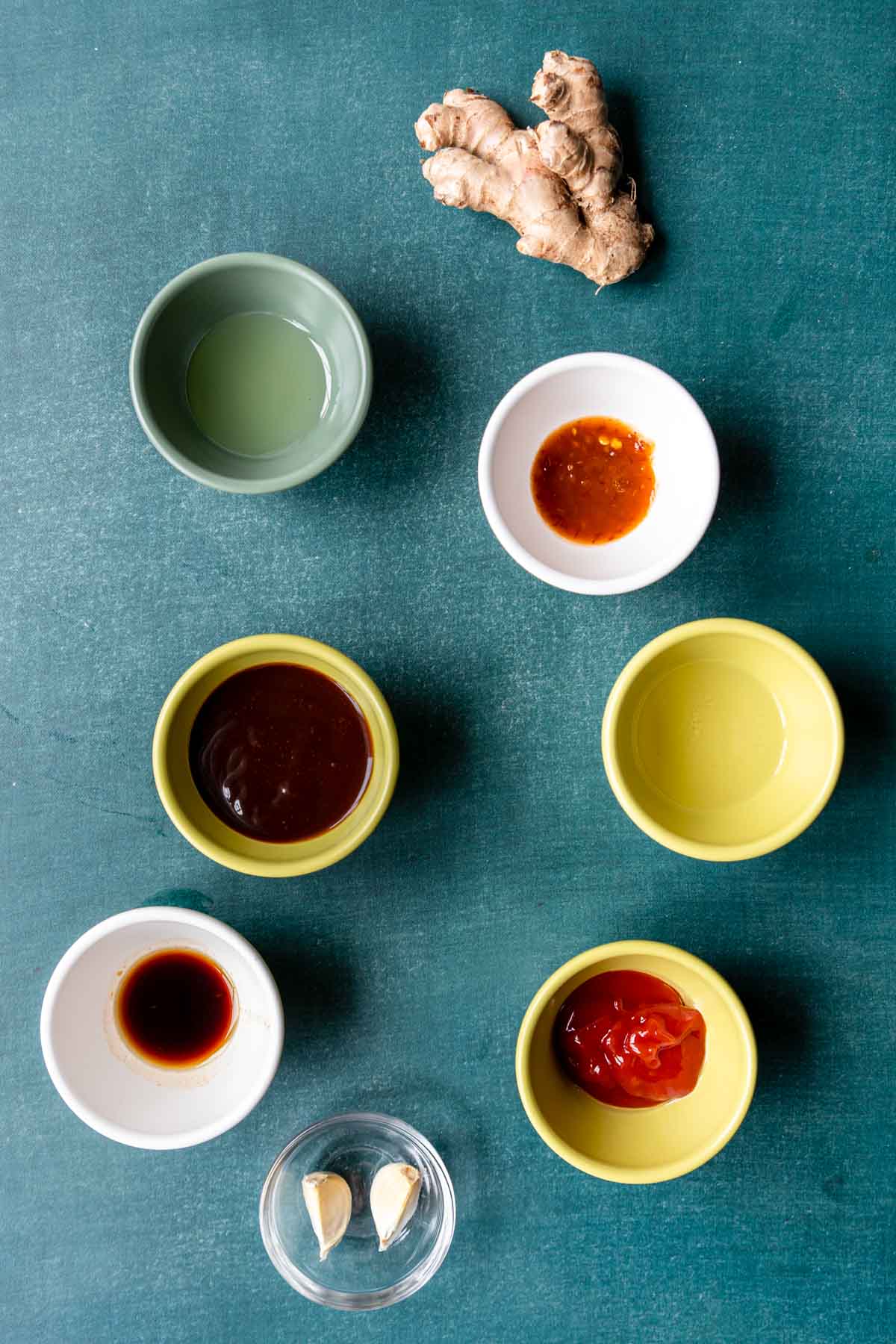 ingredients for the Hoisin Glaze on table in colorful bowls