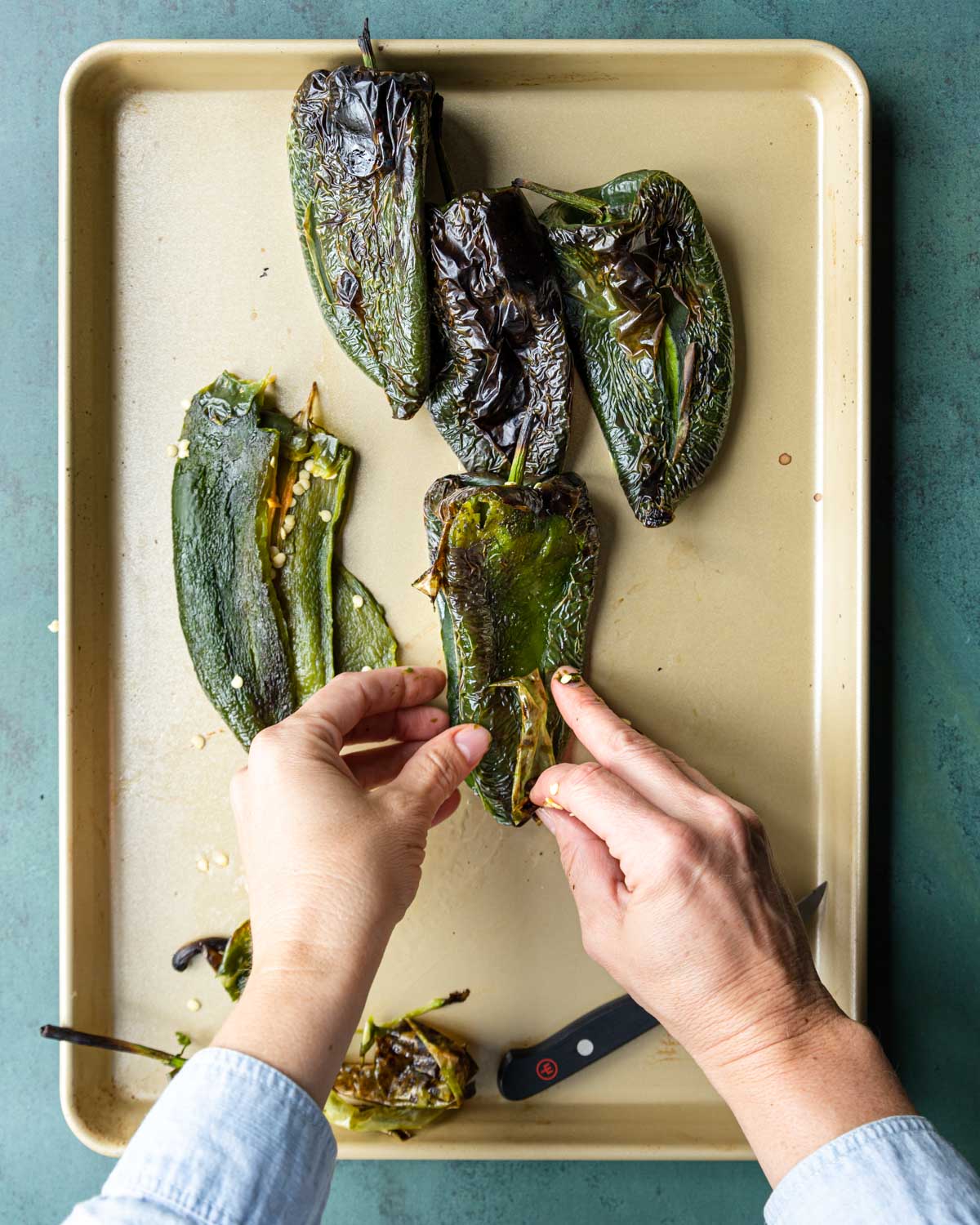 removing the skin from the poblano peppers