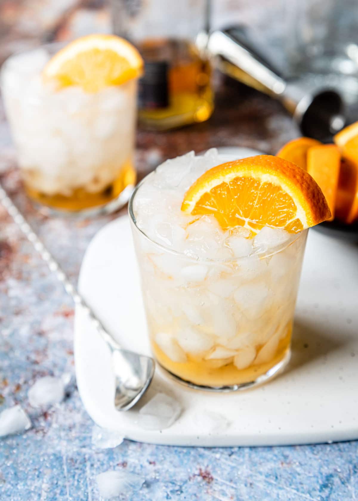 Anejo soda on the rocks with an orange wedge