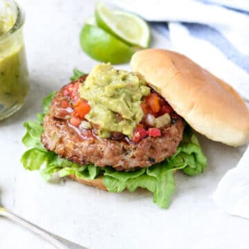 chili lime turkey burger topped with pico and guacamole