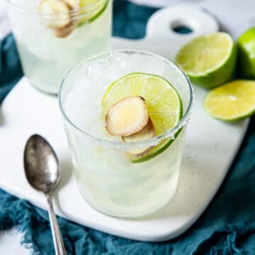 ginger margarita cocktail with a lime and fresh ginger coin