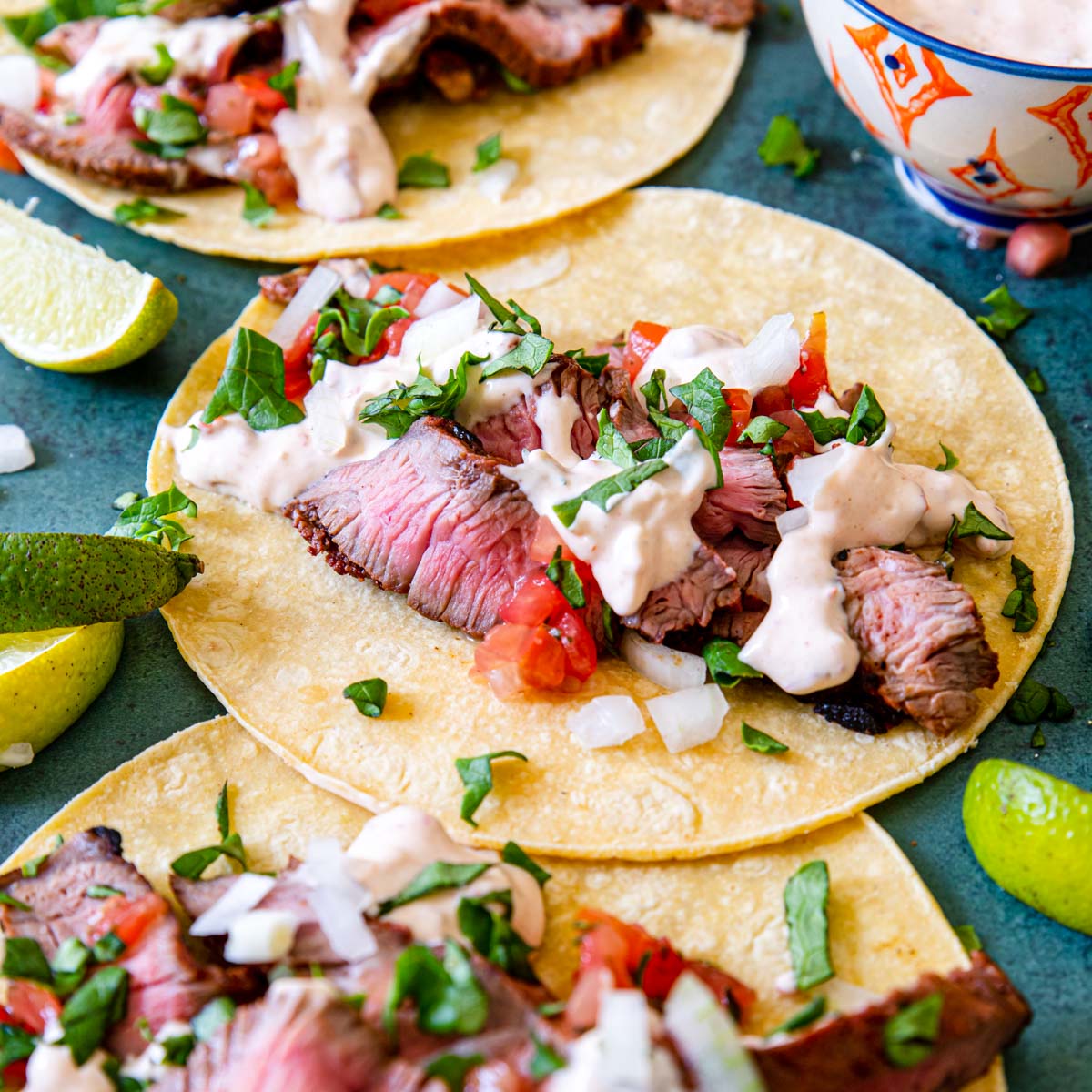 Grilled Steak Tacos assembled with pico de gallo and chipotle crema