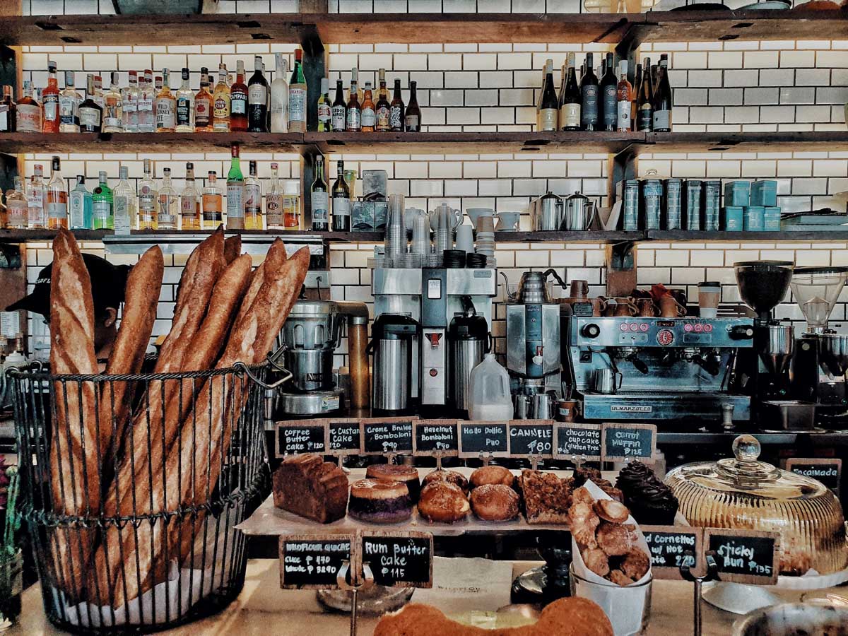 deli or bakery counter with pastries and breads