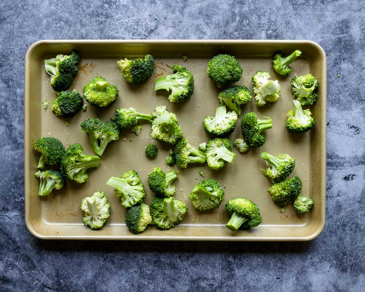 a rimmed baking sheet with broccoli 