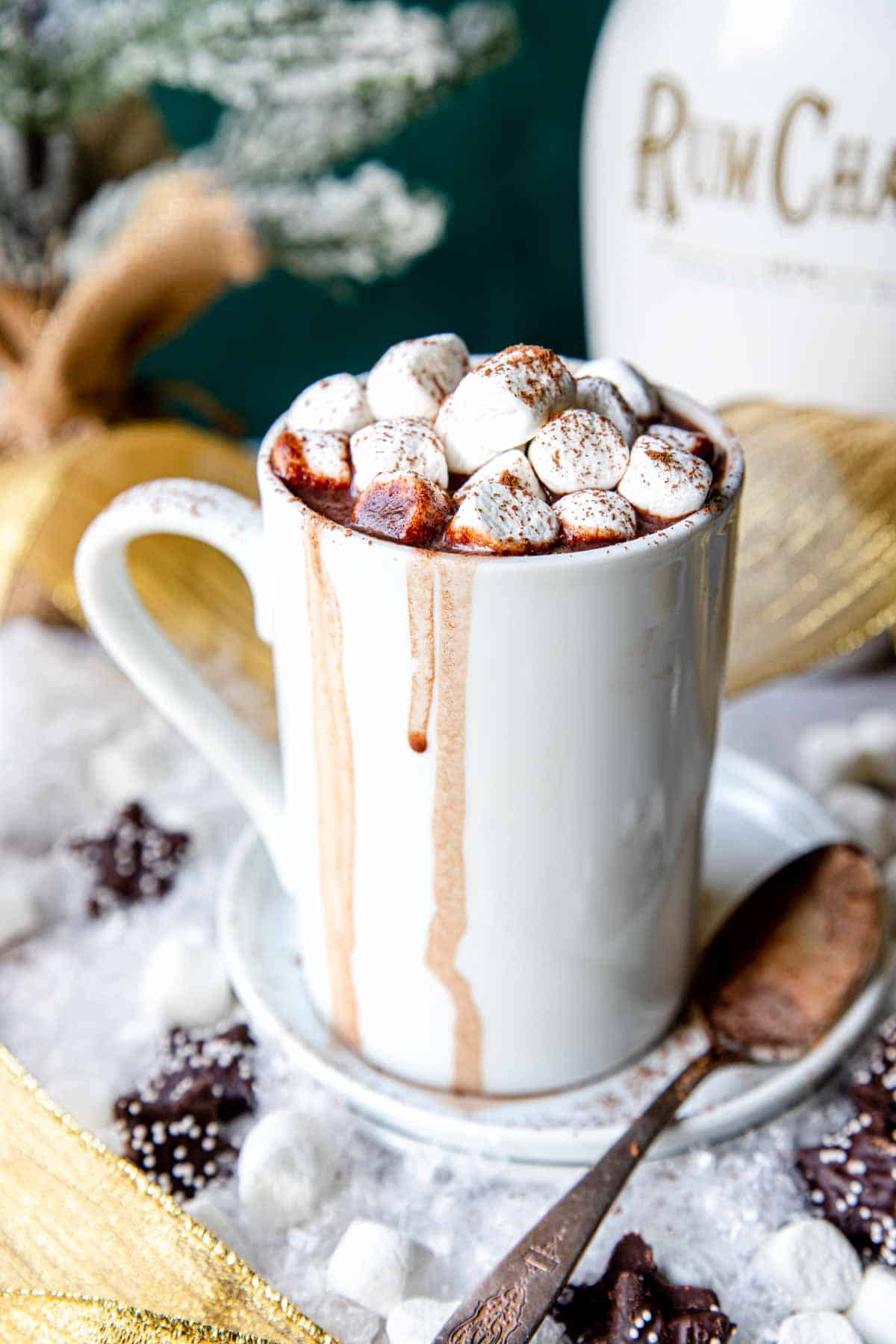 a white mug of rumchata hot chocolate and marshmallows on top