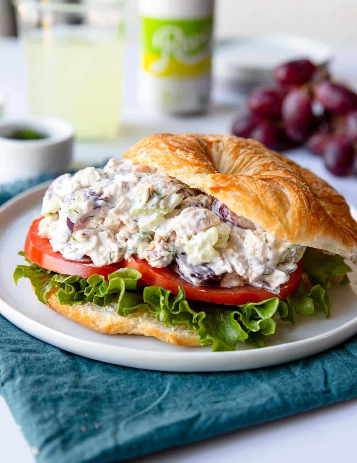 chicken salad sandwich with lettuce and thick cut tomatoes