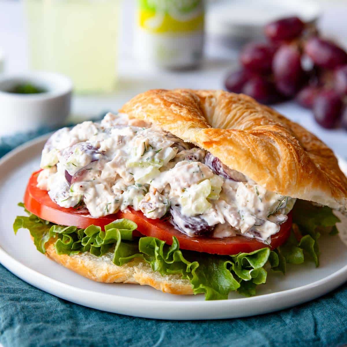 chicken salad with grapes on a croissant with lettuce and tomato