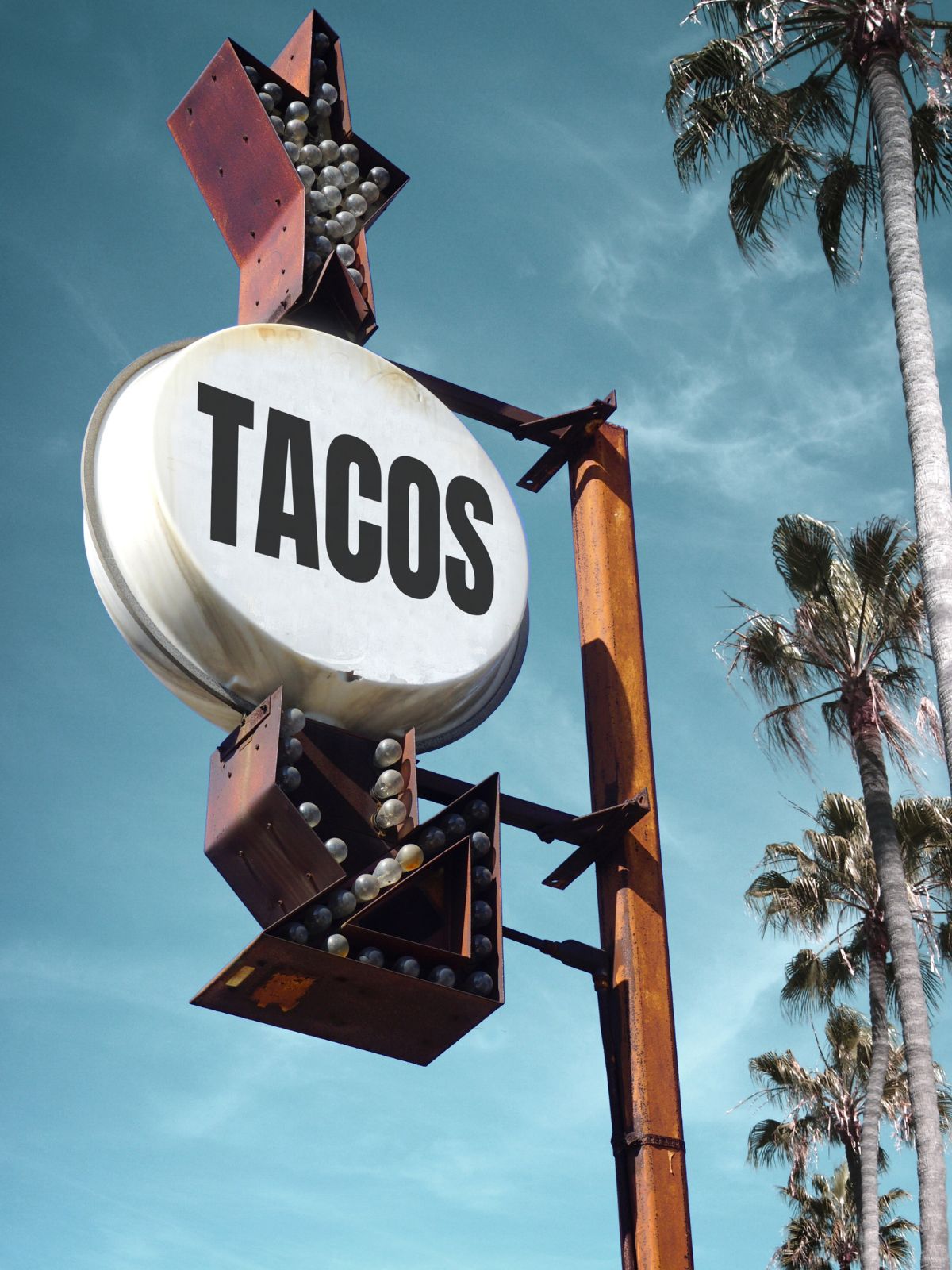 a sign that says tacos