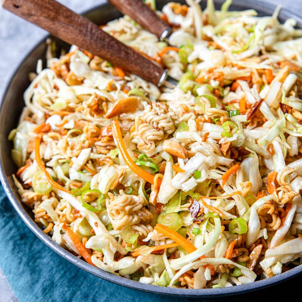 a bowl of Asian Style Coleslaw with two forks